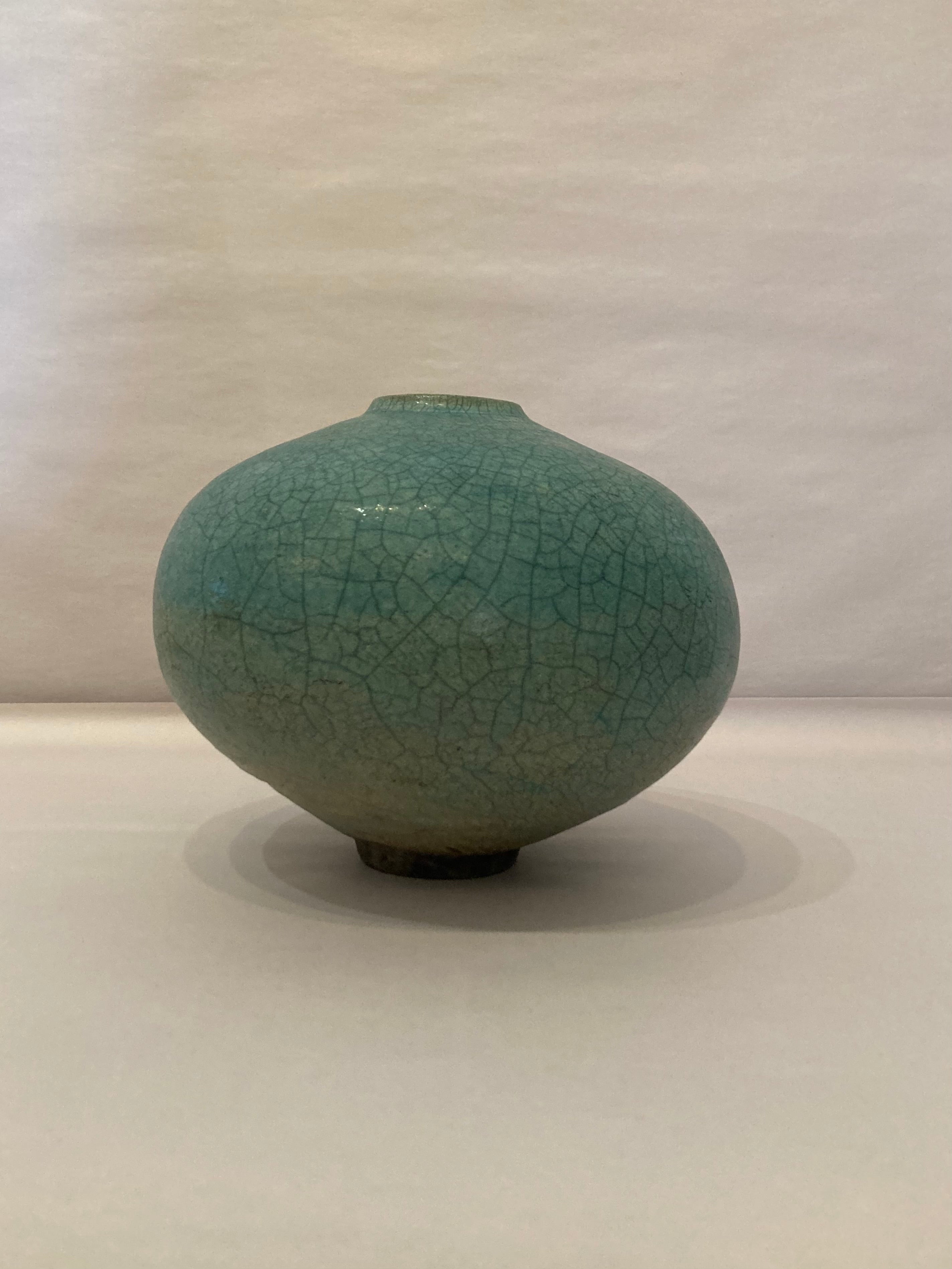 Signed turquoise raku glazed pot