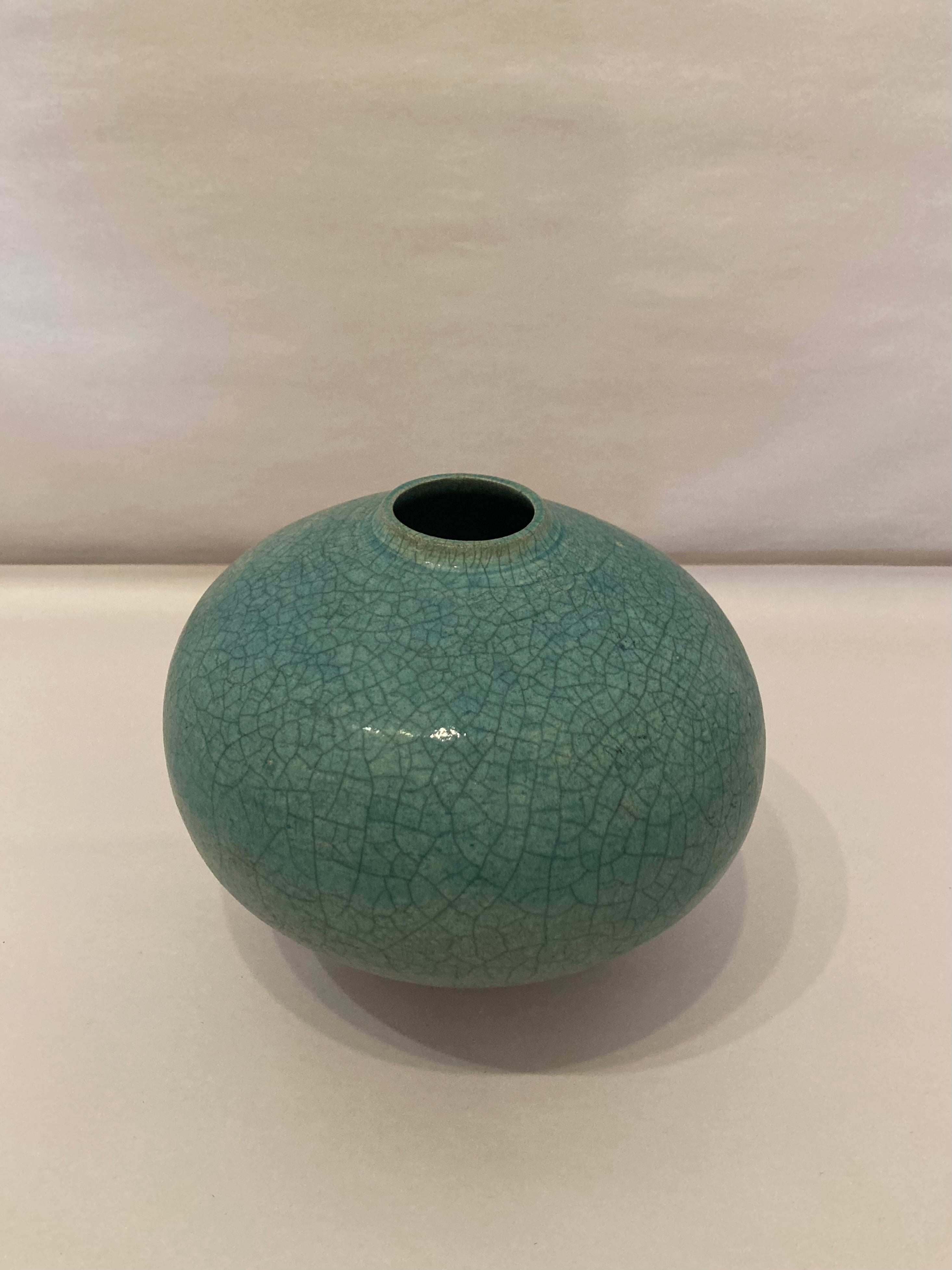 Signed turquoise raku glazed pot